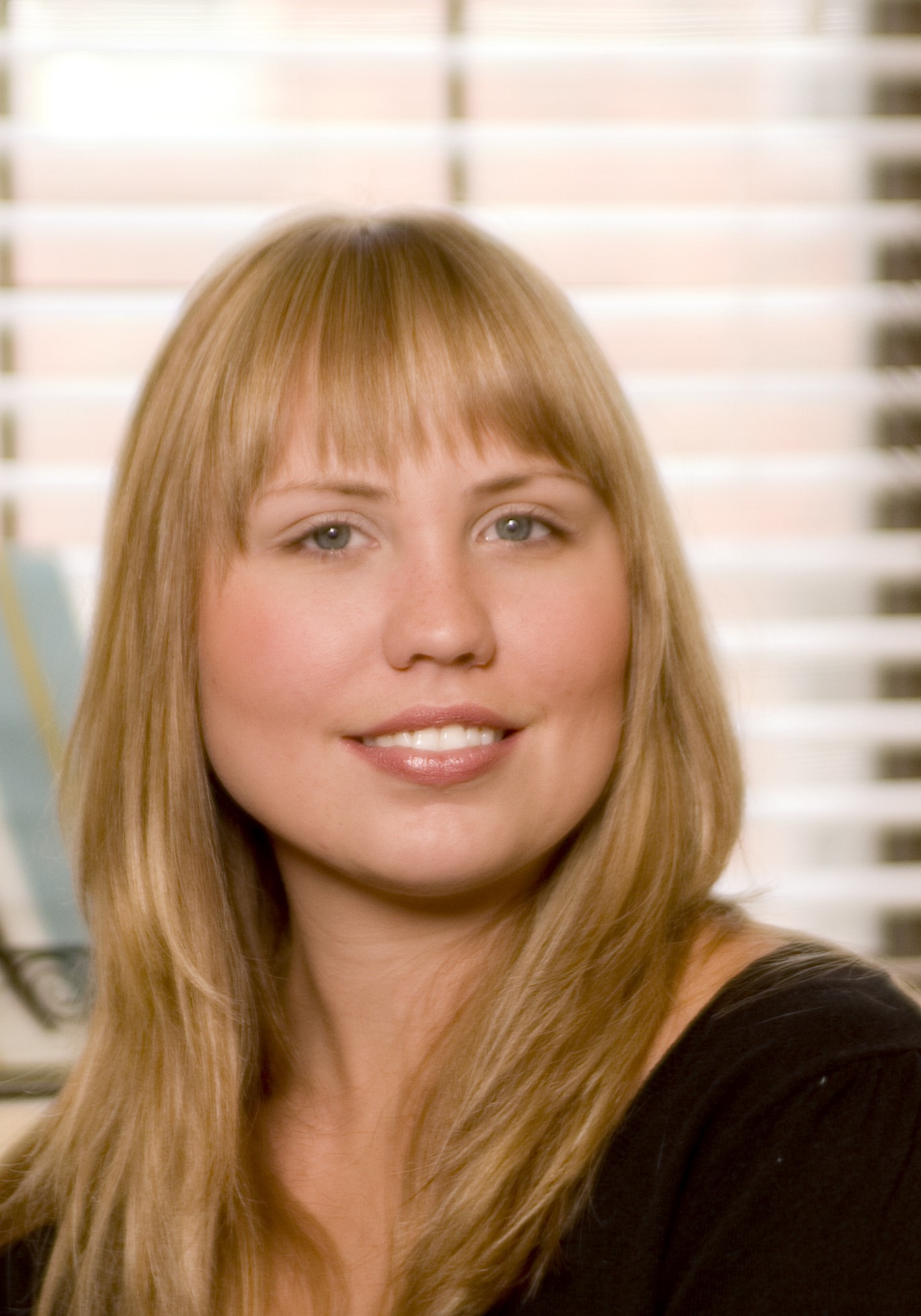 Headshot of Emily Wilson smiling.