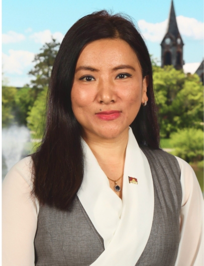 A smiling, forward-facing photo of an Asian woman with dark, straight hair, wearing a white collar and gray blazer.